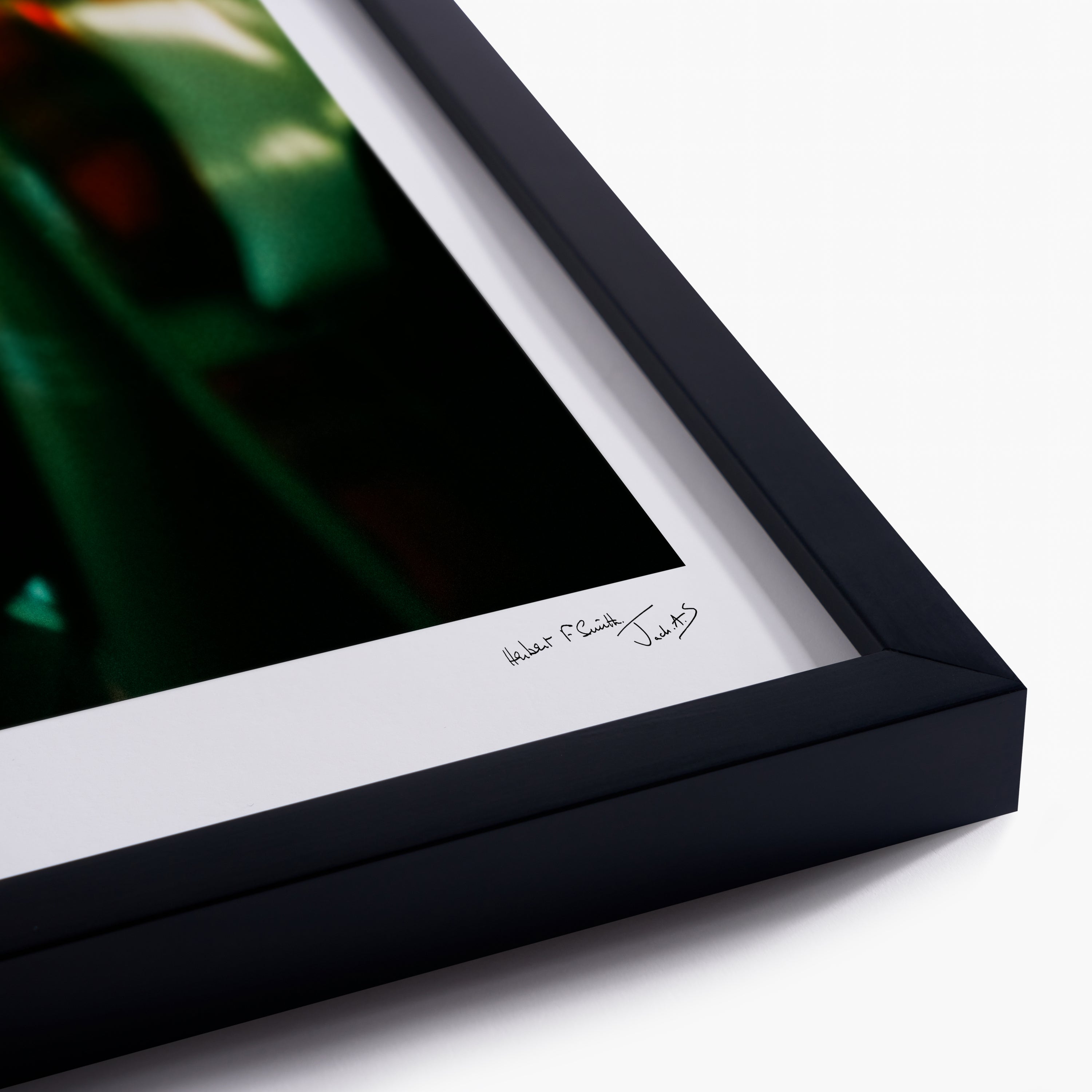 Framed artwork with a signature on a white background