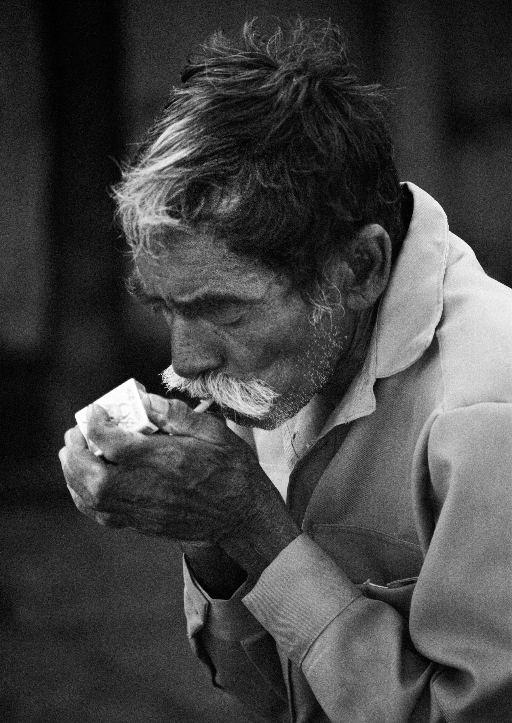 Smoker 1976 Afghanistan A Blank Wall Smoker 1976 afghanistan a blank wall